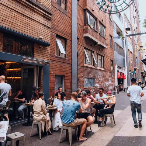 Patrons enjoying breakfast at laneway cafe Room 10 in Potts Point.