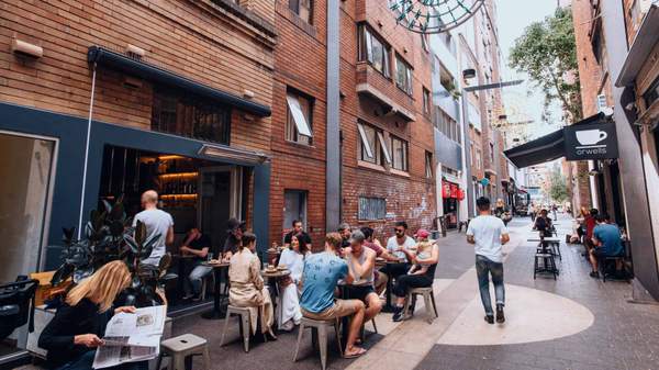 Patrons enjoying breakfast at laneway cafe Room 10 in Potts Point.