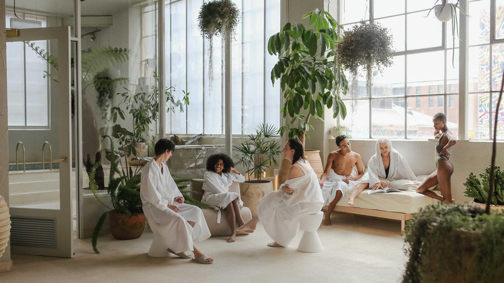 a group of people relaxing in the bathhouse at Sense of Self in Collingwood, pretty much the best spa in Melbourne
