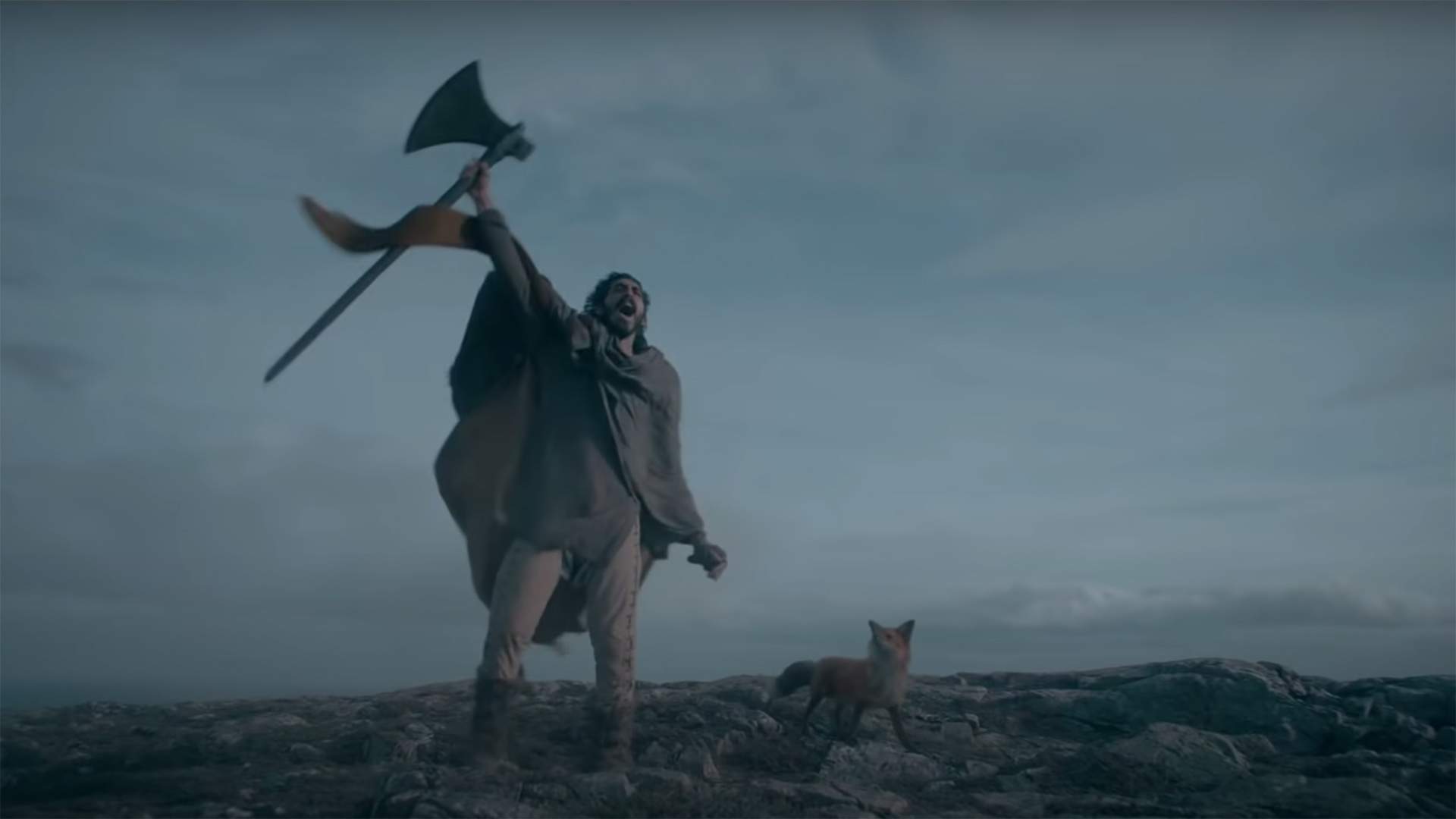The New Trailer for 'The Green Knight' Pits an Axe-Swinging Dev Patel Against an Eerie Giant