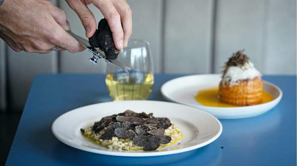 Truffles being shaved onto a risotto at Rocker - seafood restaurant in Sydney (Bondi).