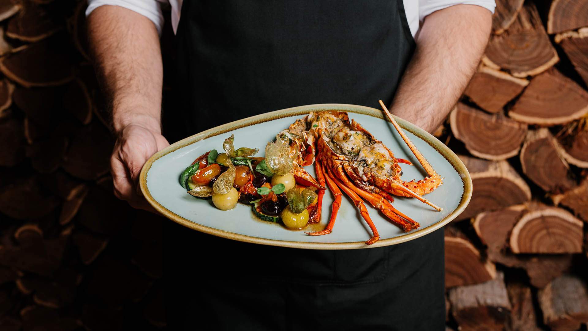 a plate with lobster at Embers at The Charming Squire in Brisbane.