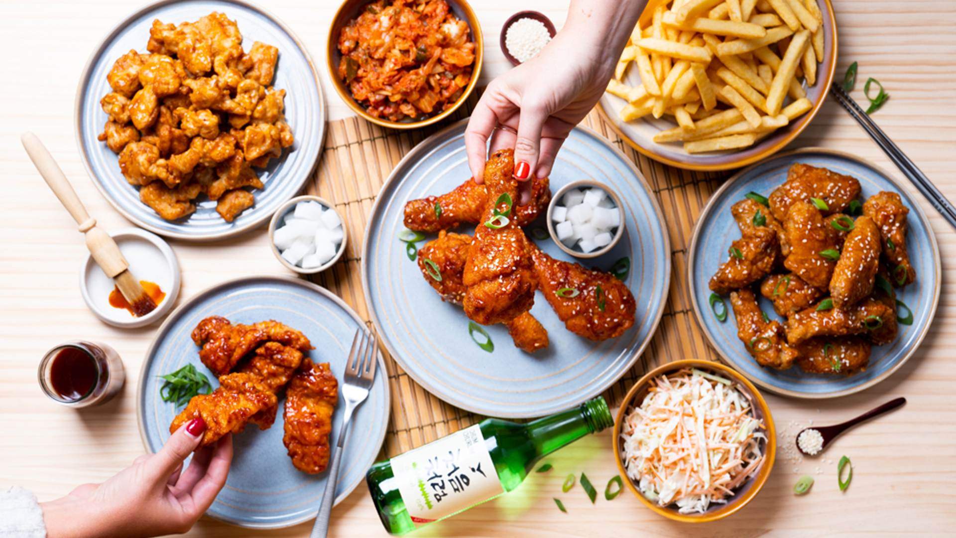 Table filled with fried chicken and side dishes