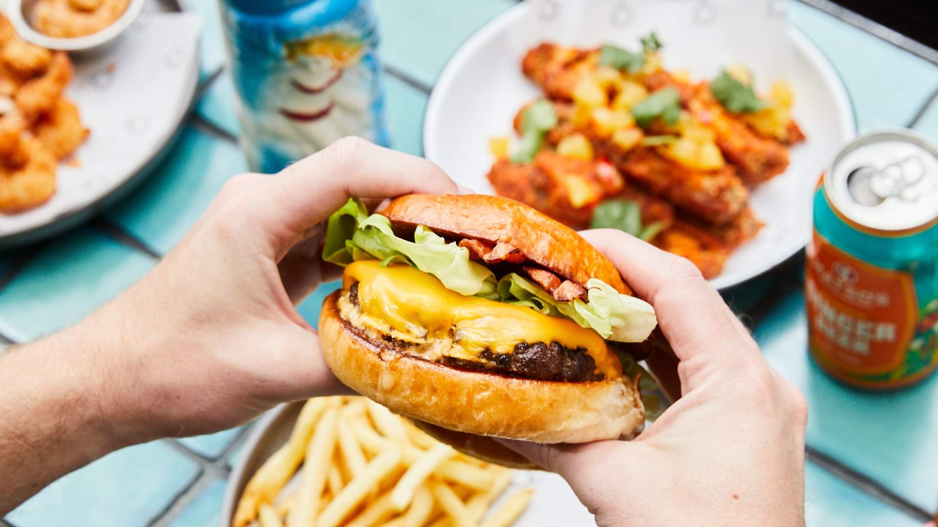 Closeup of a burger in two hands