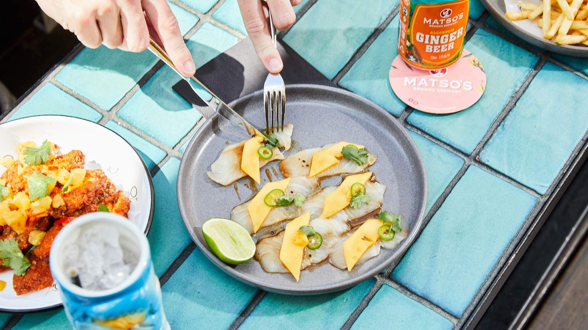Plate of ceviche on a blue tiled table