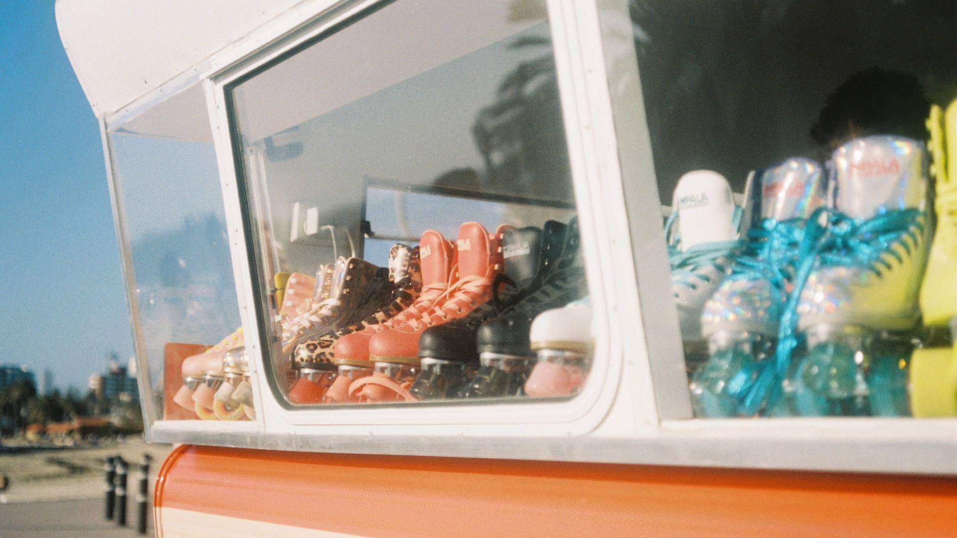 Row of roller skates through the window of a caravan