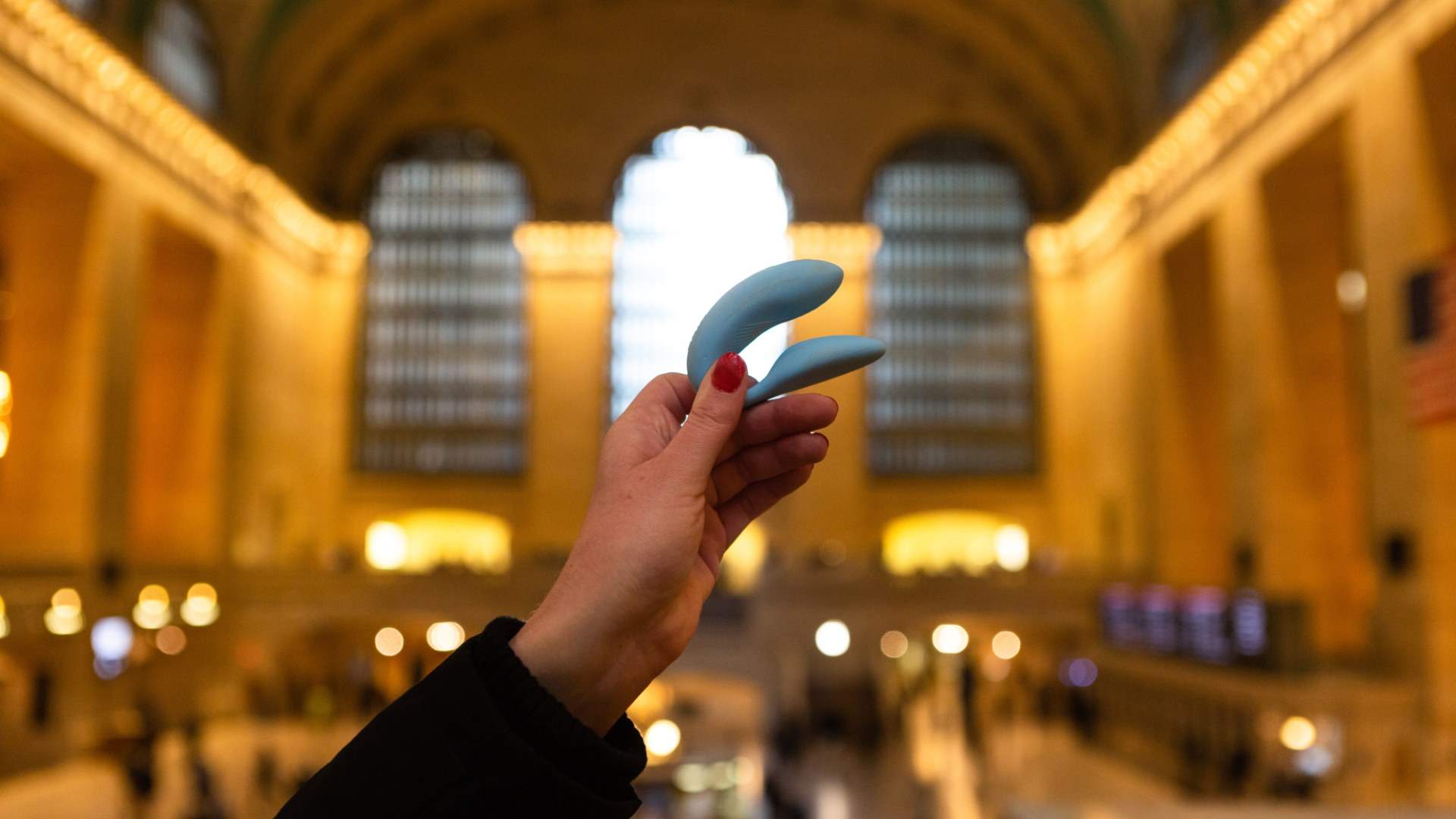 Blue vibrator being held up at Grand Central Station