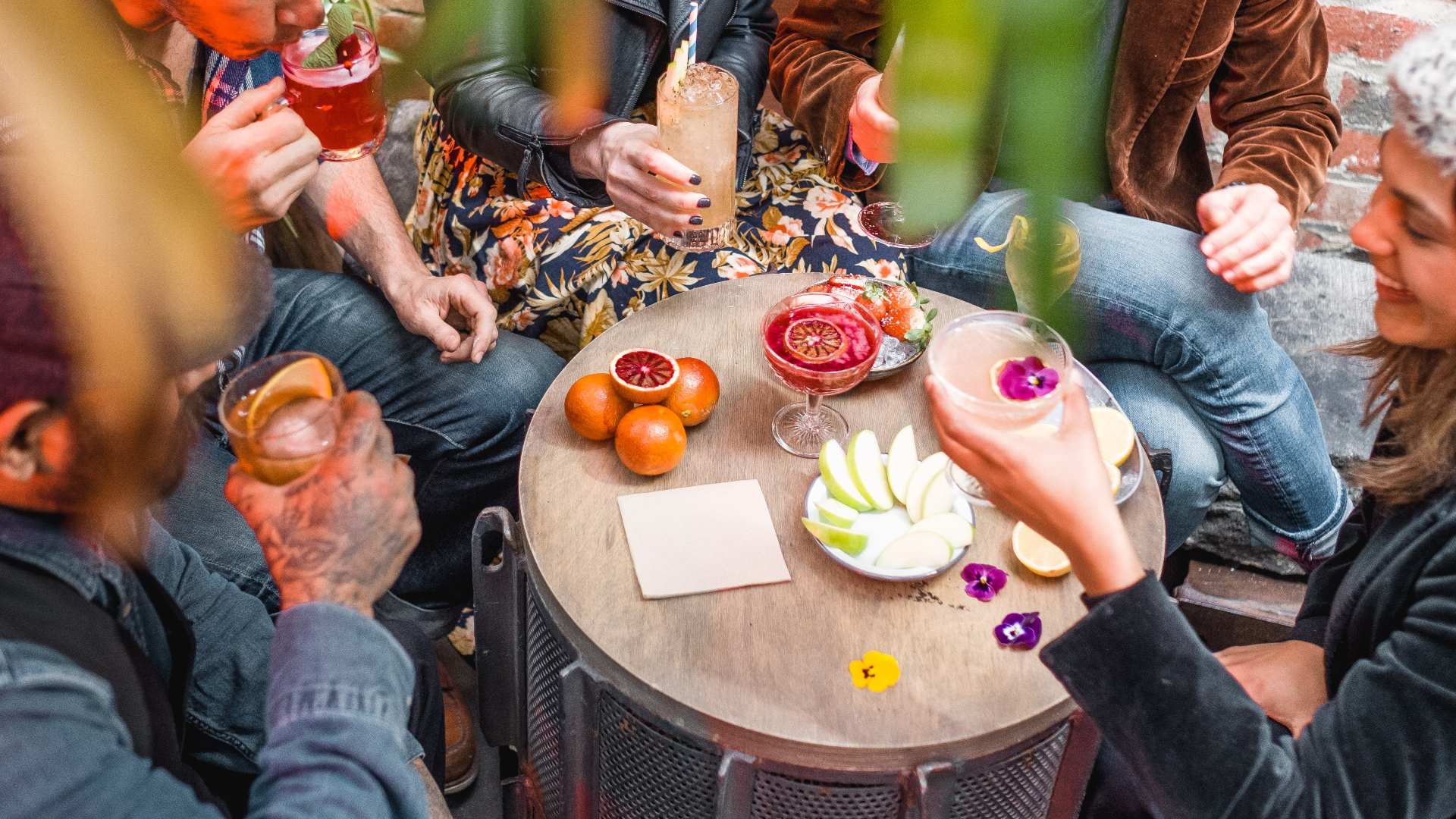 Table of people enjoying cocktails