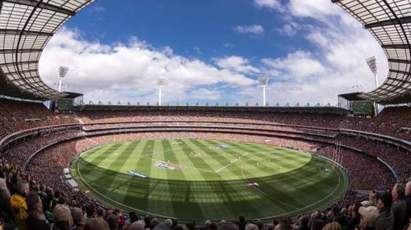 stadium crowd watching AFL game