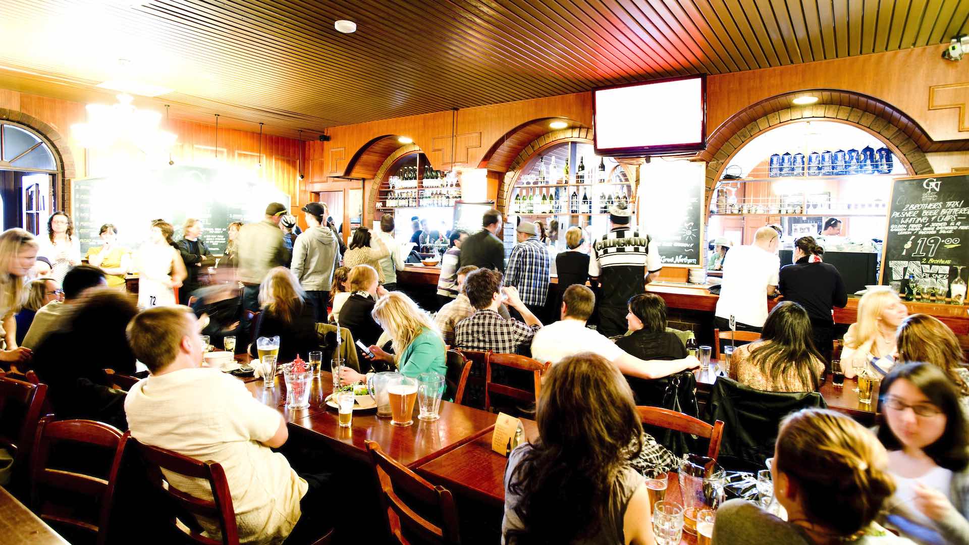 The main indoor space full of people at the Great Northern Hotel - one of the best pubs in Melbourne.