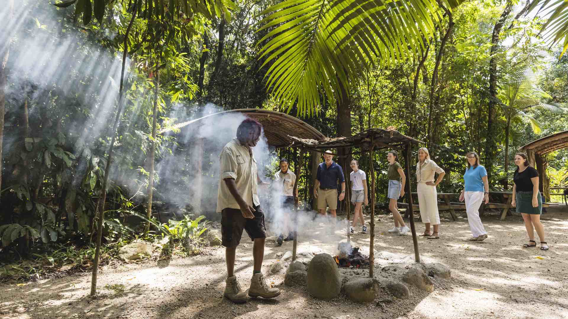 Indigenous guide, Skip, leading guests through a traditional smoking ceremony - part of the Dreamtime Walk at Mossman Gorge