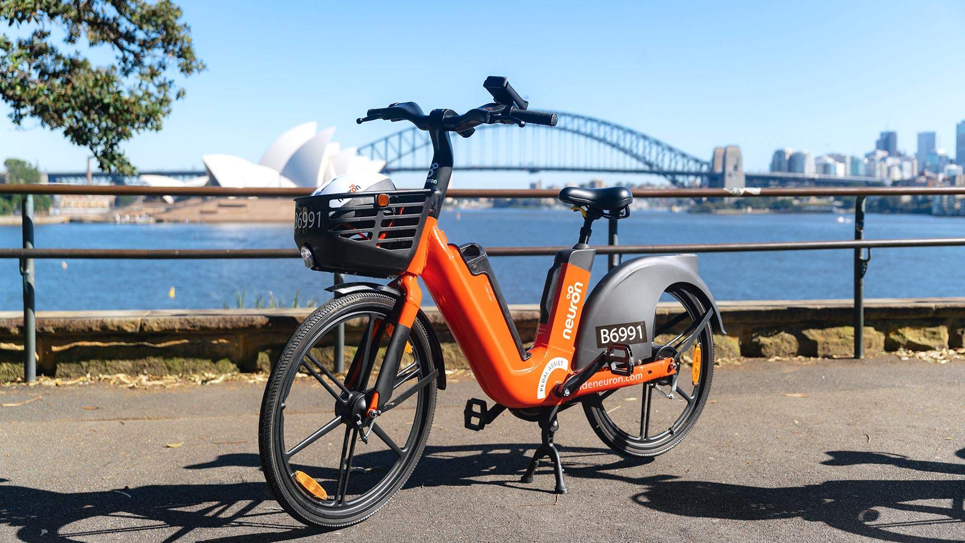 You Can Now Ride Around the CBD Bondi and Coogee On Neuron Mobility s Orange Hued E Bikes Concrete Playground