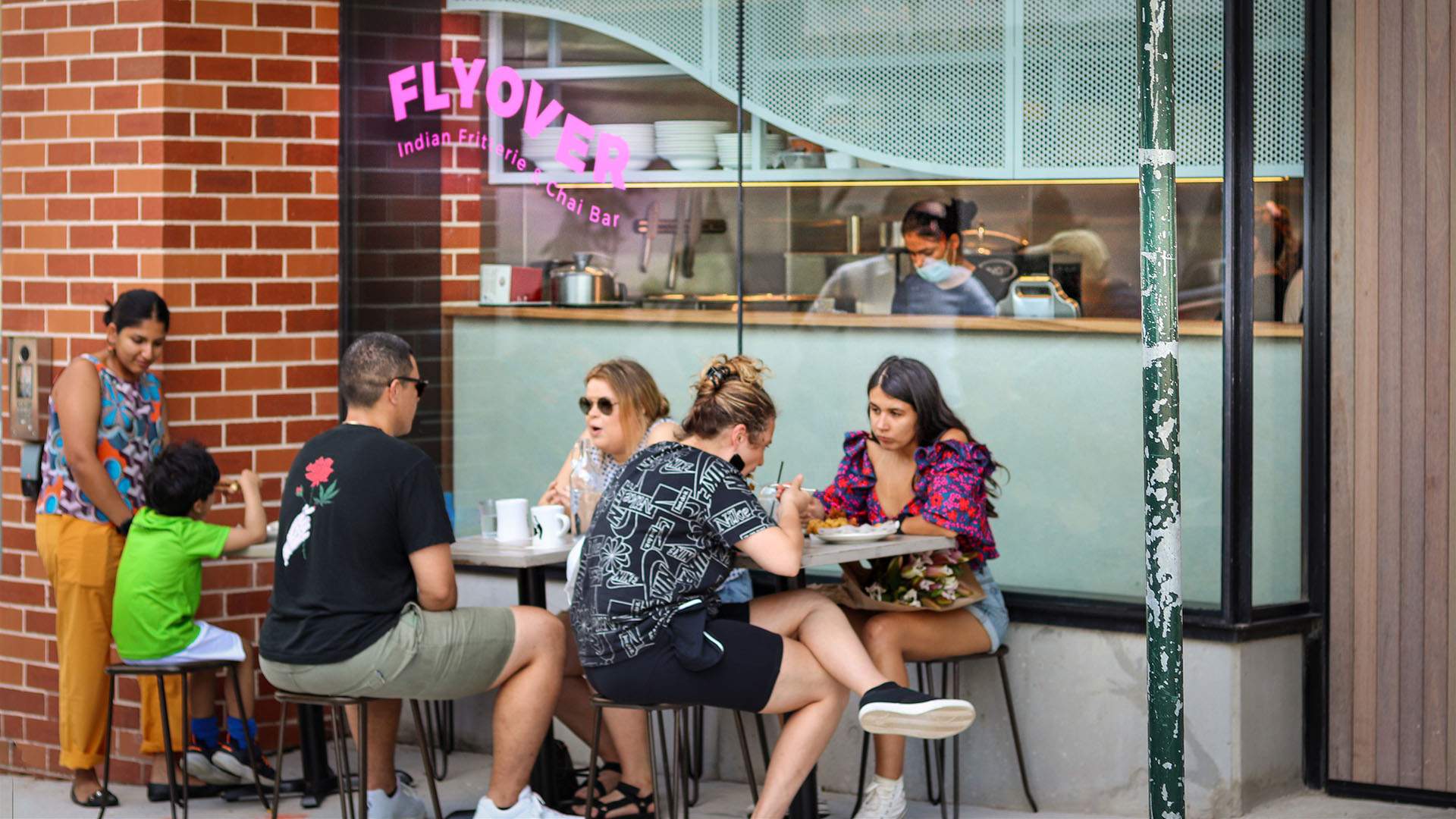 people eating outside Flyover Fritterie — one of the best vegan restaurants in Sydney
