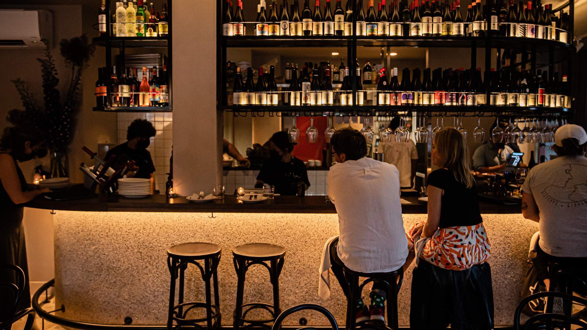 people drinking at the bar at La Salut - one of the best bars in Sydney