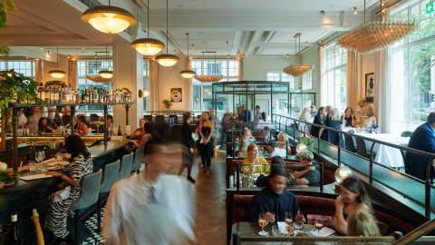 a busy dining room full of guests and staff at Gimlet at Cavandish House - one of the best restaurants in Melbourne