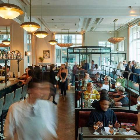 a busy dining room full of guests and staff at Gimlet at Cavandish House - one of the best restaurants in Melbourne