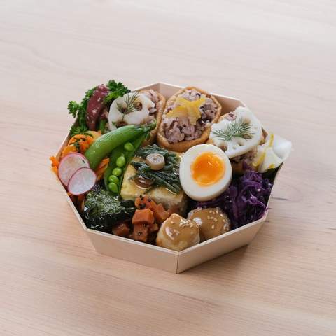 A close up of a bowl packed with assorted foods sold at Hareruya Pantry.