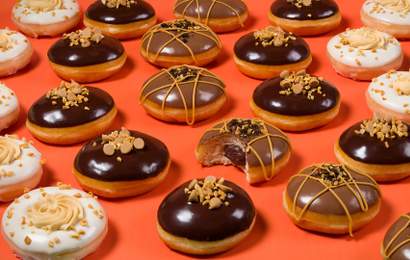 Background image for Krispy Kreme and Reese's Have Teamed Up on a Tastebud-Tempting New Range of Peanut Butter Doughnuts