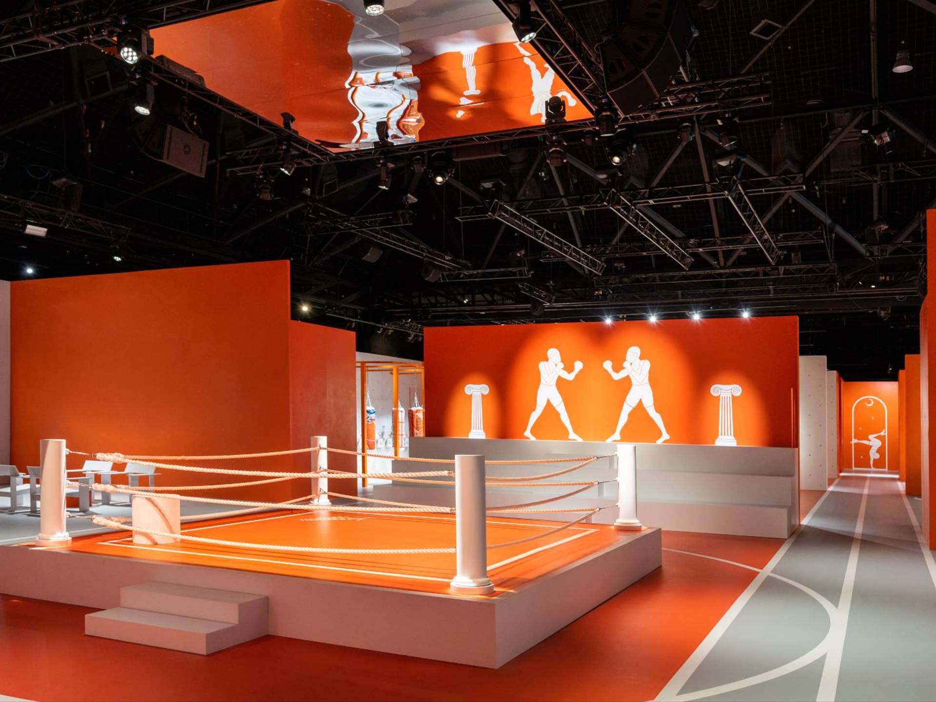Hermès Fit, a pop-up featuring its very own gym, adorned with hermes'  signature orange color and pattern, while also exhibiting some of its…