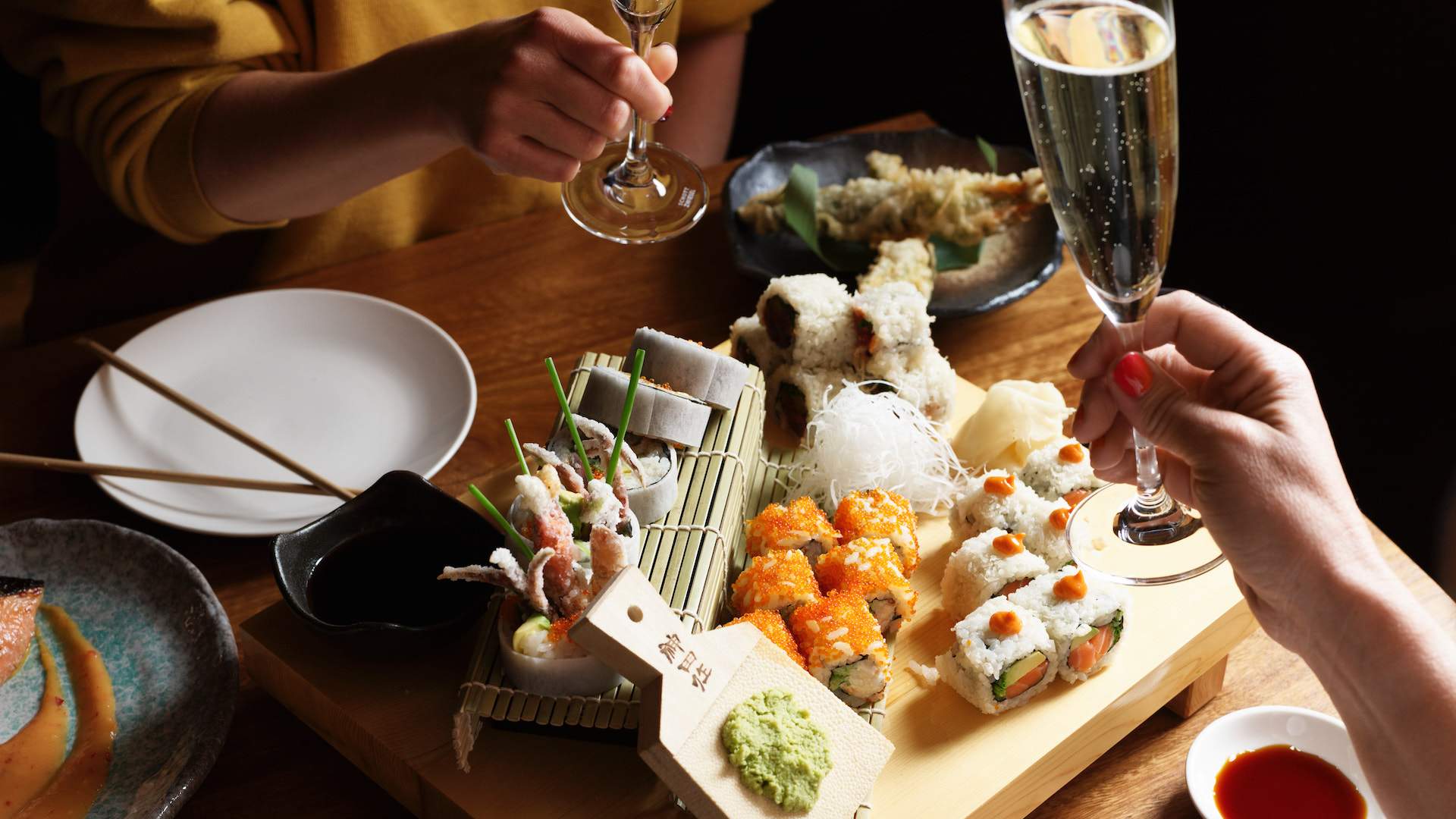 a platter of nigiri and sushi with champagne at TOKO restaurant in Sydney's CBD