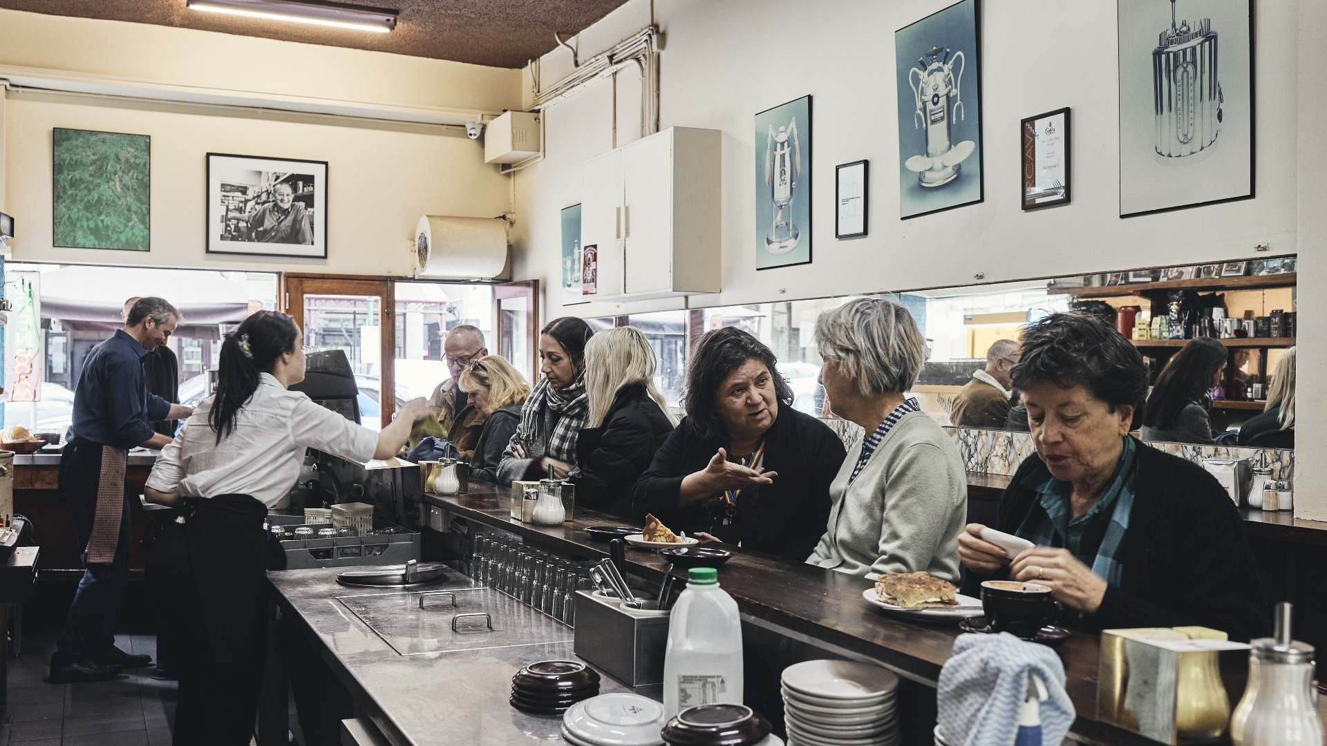 people dining at the bar at Pellegrini's Espresso Bar - home to some of the best pasta in Melbourne