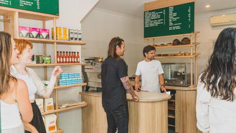 Busy scene of customers in Good Ways Deli shop.