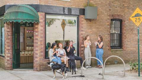 People sitting outside Good Ways Deli in Alexandria.