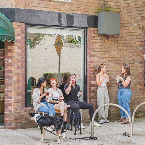 People sitting outside Good Ways Deli in Alexandria.