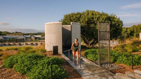 Someone walking out of a shower at Alba Thermal Spa - the best day spa in Melbourne