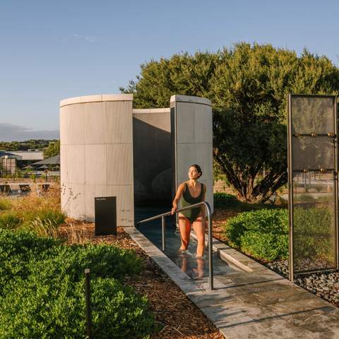 Someone walking out of a shower at Alba Thermal Spa - the best day spa in Melbourne