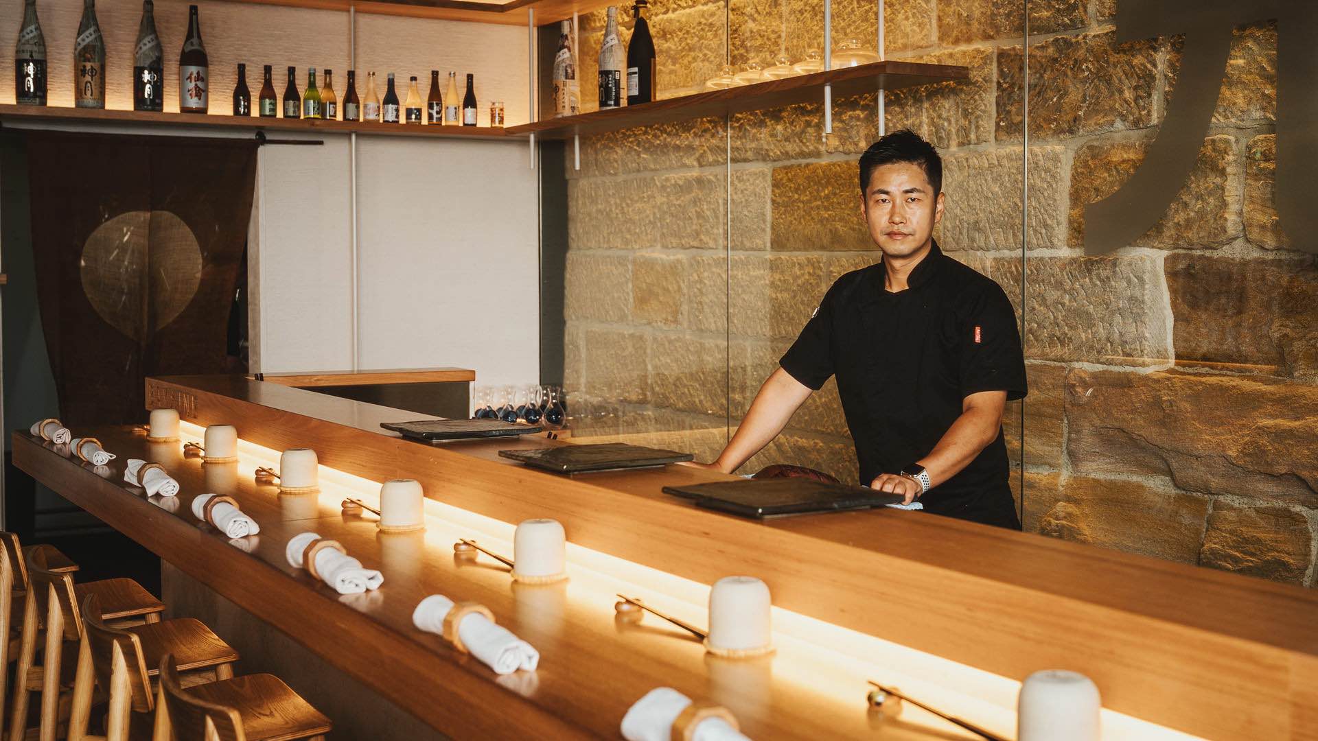 Chef standing at the counter at Bay Nine - one of the best seafood restaurants in Sydney - omakase