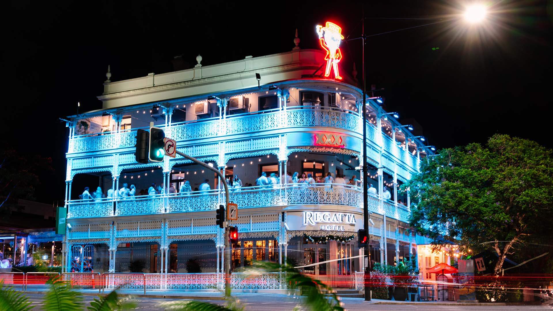 A view of the Regatta Hotel lit up at night - one of the best sports bars in Brisbane
