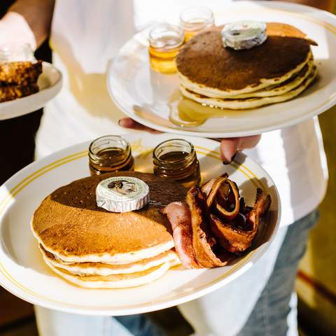 Plates of pancakes at happyfield - one of the best cafes in Sydney