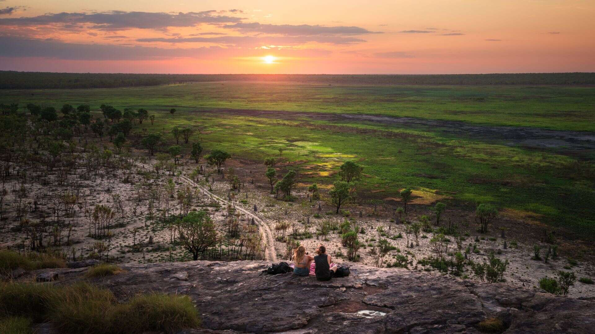 130491-Couple-enjoying-the-sunset-at-Ubirr.-Tourism-NT_Daniel-Tran.-Supplied Experience stunning vistas, epic wonders and the unique flora and fauna in the tropics of the Top End at Kakadu National Park.
