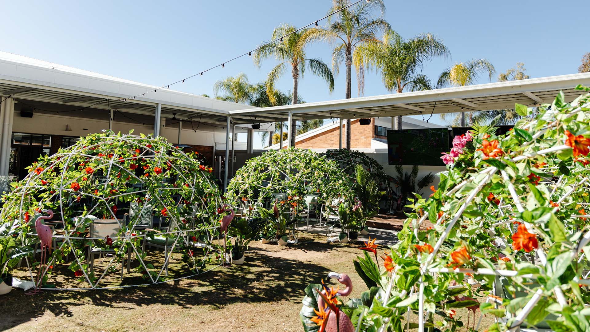 Bribie Island Hotel Has Added Greenery-Covered Pods to Its Fairy Light-Lit Beer Garden for Winter