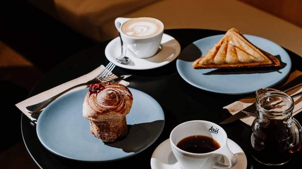 table with coffee and cakes at Axil Coffee Roasters, Melbourne coffee