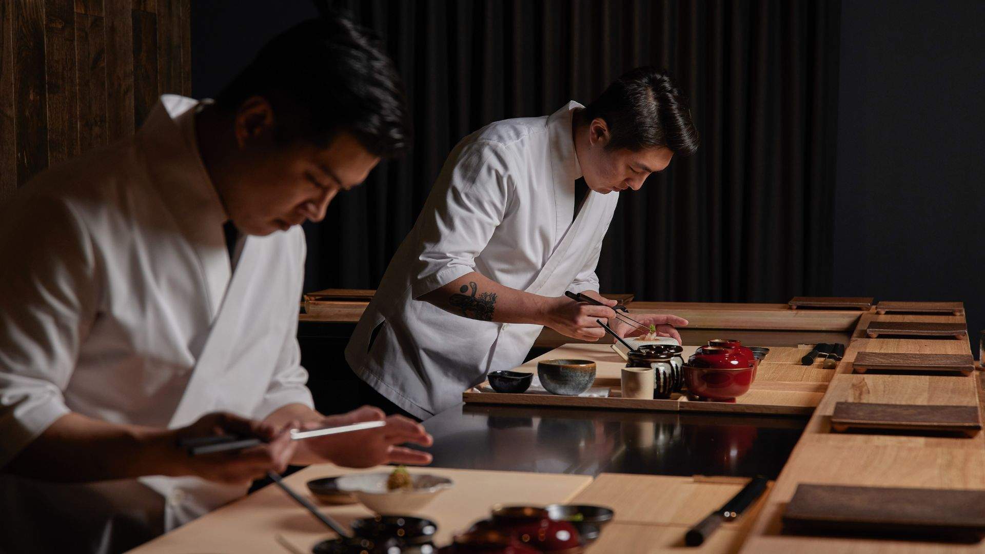 Two chefs preparing food at Aoi Tsuki, South Yarra. Home to some of the best omakase in Melbourne.