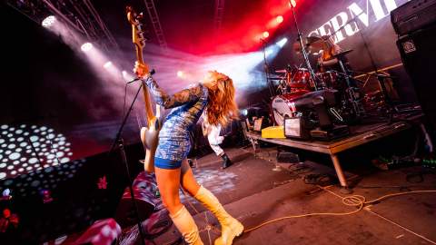 Photo of musician with guitar performing at BIGSOUND Festival.