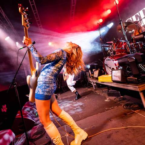 Photo of musician with guitar performing at BIGSOUND Festival.