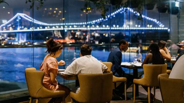 people dining with a view of Brisbane River from Blackbird Bar & Grill