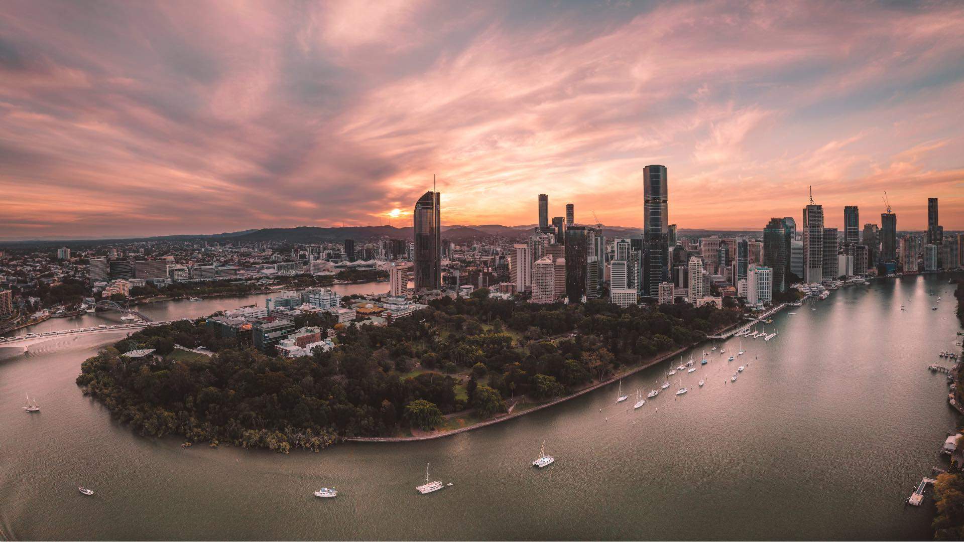 Photo of sunset with Brisbane city skyline.