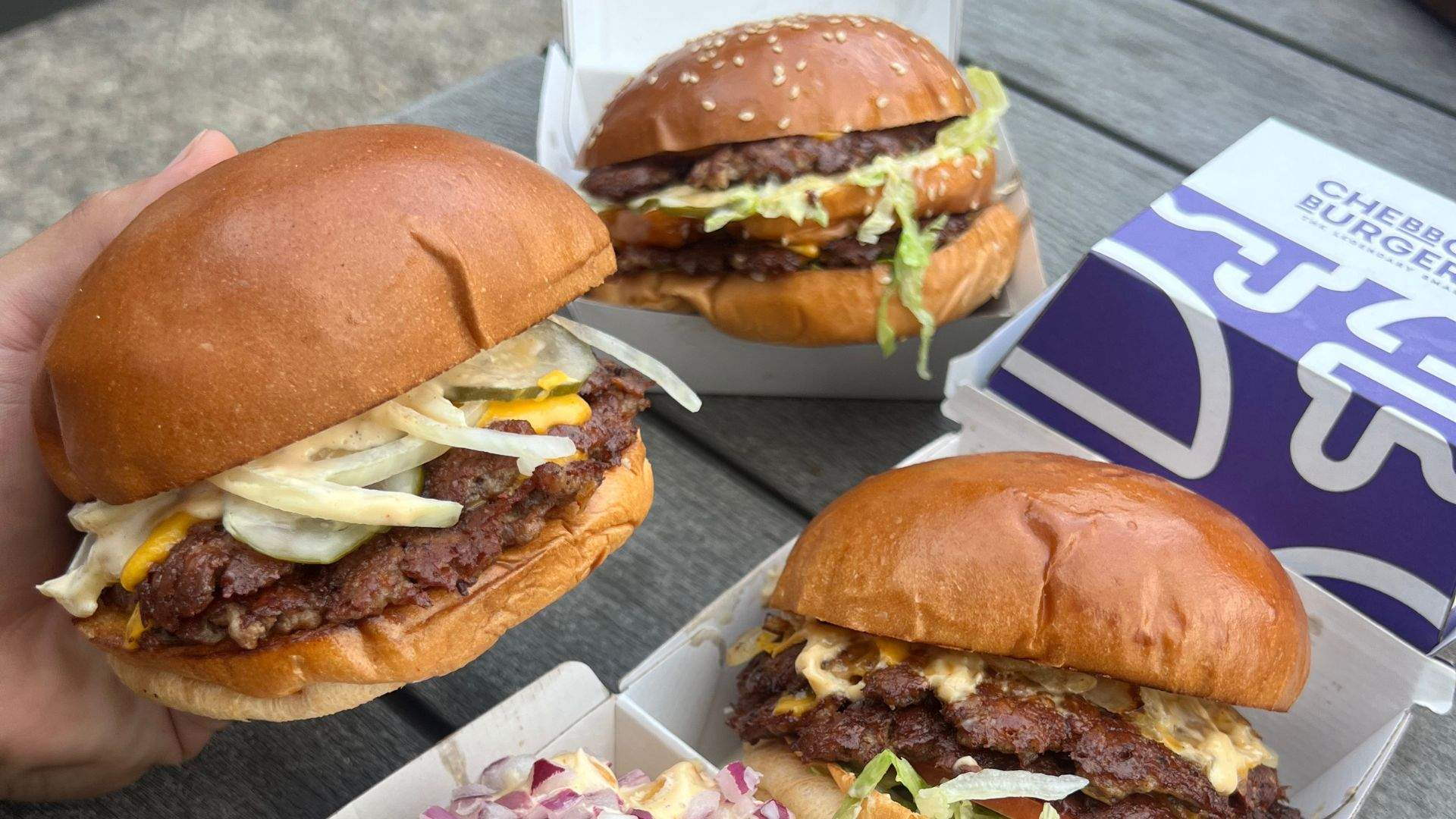 Three smash burgers from Chebbos Burgers food truck — home to some of the best burgers in Sydney.