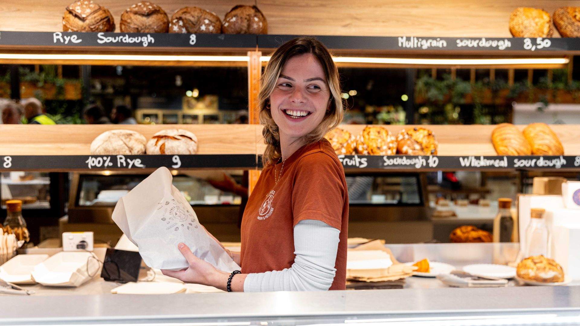 Staff member serving at Frenchies Bakery & Pâtisserie Rosebery.