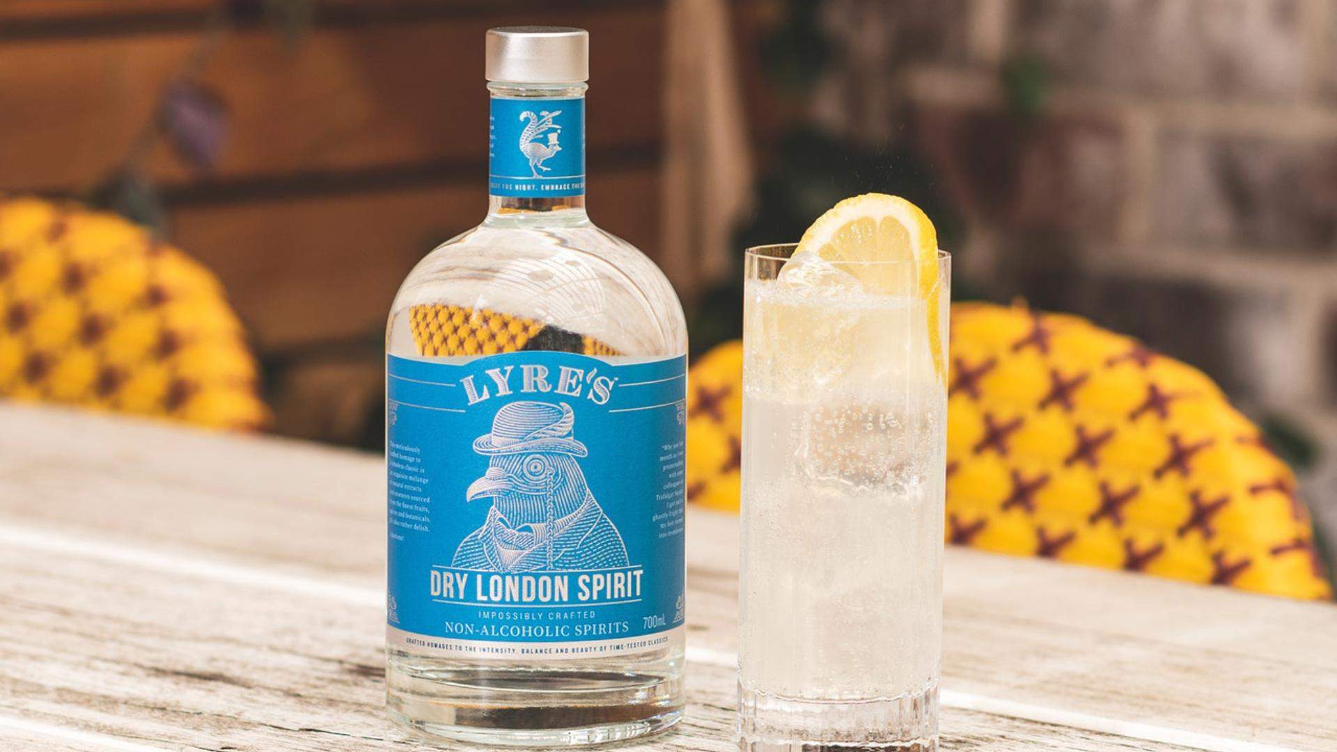 Bottle of Dry London Spirit next to a G&T.