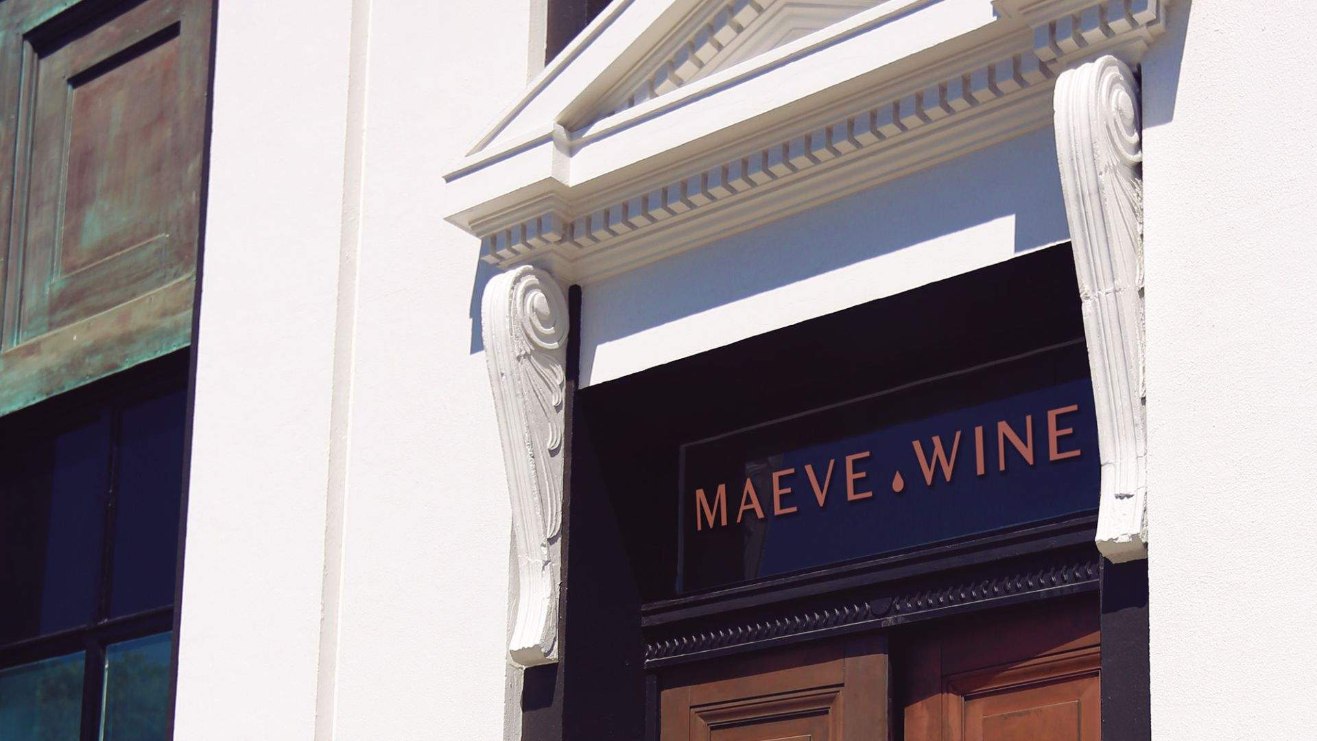 Close up shot of entrance, including label of Wine Bar, Maeve Wine.