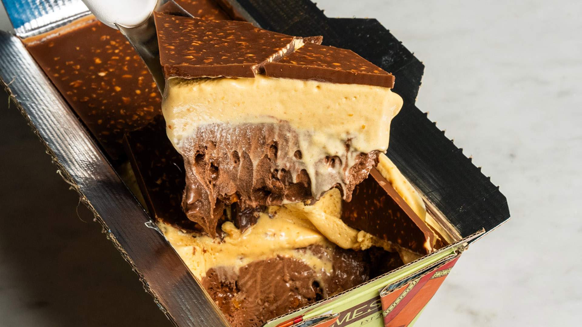 Messina's Latest Limited-Edition Gelato Tubs Come Topped with Hazelnut Rocher Crack