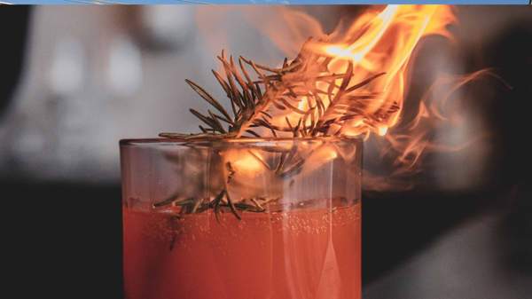 A cocktail on fire at Noir in Brisbane - wine bar in Brisbane