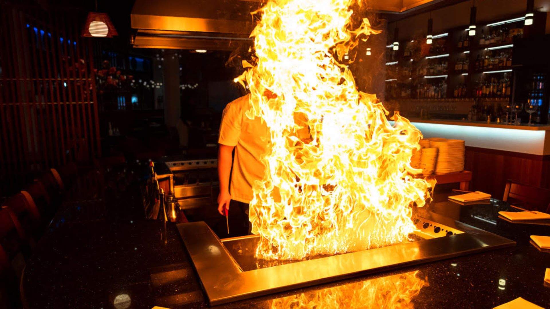 Huge flames coming off the teppanyaki grill at Oyama - one of the best Japanese restaurants in Brisbane.