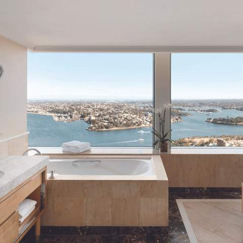 A bathroom with a view of Sydney Harbour at the Shangri-La Hotel.