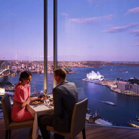 A couple having a meal overlooking Sydney Harbour at the Shangri-La Sydney hotel.